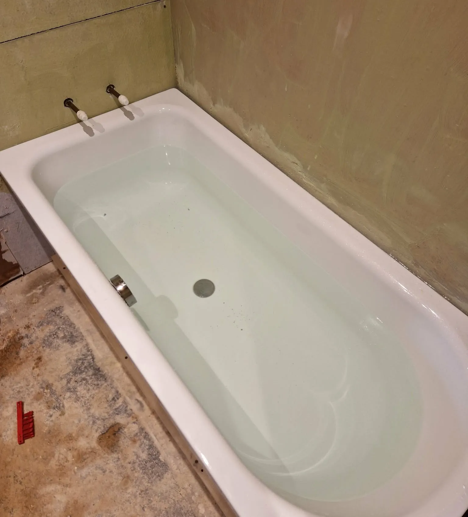 New bath fitted, with the walls boarded and ready for tiling